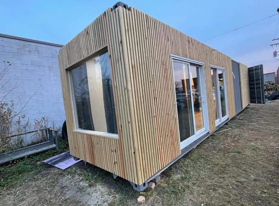 For sale is a stunning 40-foot container home, designed with quality and functionality in mind. The container is brand new and has been perfectly insulated in every corner to provide optimal thermal regulation. It is fully equipped with all necessary furniture and amenities, including a sleeping space for 4 people, kitchen, and a fully functional bathroom with washer and dryer all in one

The container home features a large window at one end, providing a beautiful view, as well as two sliding doors. At the other end, there is a free-standing tub with the option to keep both container doors open for a wide view, while still ensuring privacy when needed.

The home is equipped with a 27,000 BTU air conditioning and heating system and has a 100 AMP electrical panel to ensure sufficient power for all your needs. The hot water tank has a capacity of 40 gallons. To ensure maximum safety and quality of the wall structure, a layer of plywood has been added before the drywall installation. The electrical system is also ready to accommodate a hot tub installation.

This container home was designed with the intention of being used for AirBnb, providing a unique and comfortable accommodation experience for guests. The asking price for this high-quality, fully equipped and insulated Don't miss out on the opportunity to own this one-of-a-kind home! See less